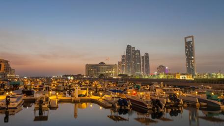 Serene Marina at Dusk Overlooking City Lights wallpaper