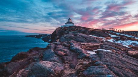 Seaside Serenity: A Lighthouse at Dusk wallpaper