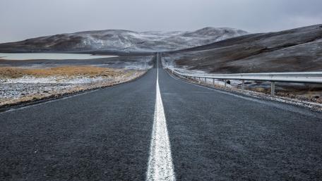 Straight Road Through Winter Mountains wallpaper