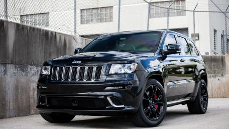 Sleek Black Jeep Urban Adventure wallpaper