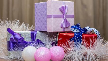 Joyful Christmas Gift Display for Holiday Cheer wallpaper