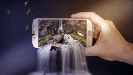 Enchanted Waterfall Emerging from a Smartphone wallpaper