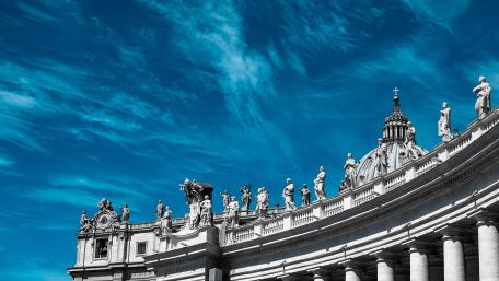 Statues on top of building wallpaper