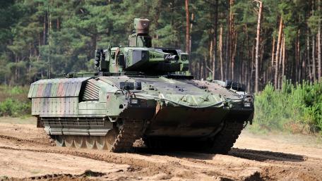 Powerful Tank Movement in Nature's Embrace wallpaper