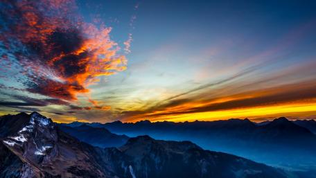 Majestic Sunset Over Mountain Range wallpaper