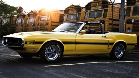 Classic Yellow Cabrio Under Sunset Glow wallpaper