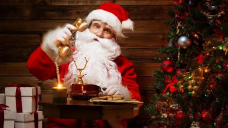Cheerful Santa Claus Spreading Holiday Joy wallpaper