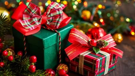 Festive Christmas Gifts Wrapped in Cheerful Colors wallpaper