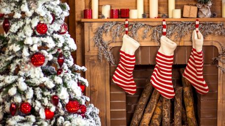 Cozy Christmas Fireplace with Striped Socks wallpaper