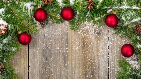 Festive Christmas Decorations on Wood Planks wallpaper