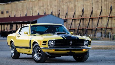 Classic Yellow Ford Mustang on Display wallpaper