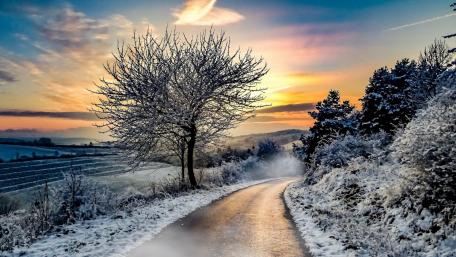 Winter Road Through a Frosty Landscape wallpaper