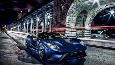 Sleek Blue Ford GT Under Urban Lights wallpaper