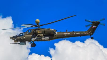 Dynamic Helicopter in Flight Above the Clouds wallpaper