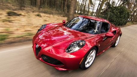 Sleek Red Alfa Romeo on a Scenic Drive wallpaper