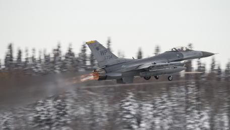 Dynamic Military Jet in Action Capturing Power and Precision wallpaper