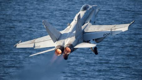High-Flying Military Jet in Action wallpaper
