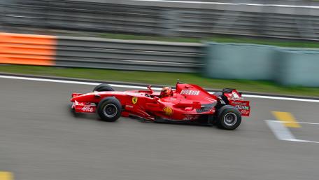 Ferrari F1 Car in Action Among Speed and Precision wallpaper