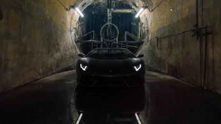 Dark Elegance of the Lamborghini Aventador in a Tunnel Light Show wallpaper