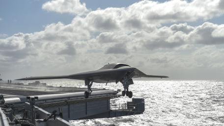 Advanced Military Drone Over Sea Scene in 4K Wallpaper wallpaper