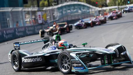 Fast-Paced Electric Racing Experience in Motion wallpaper