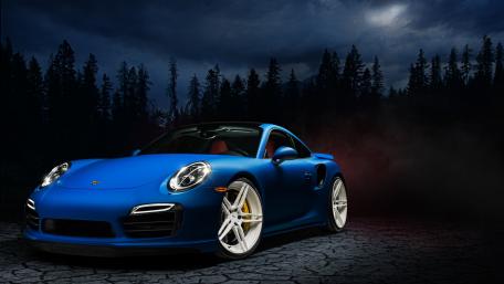 Dynamic Blue Porsche Turbo in a Stark Setting wallpaper