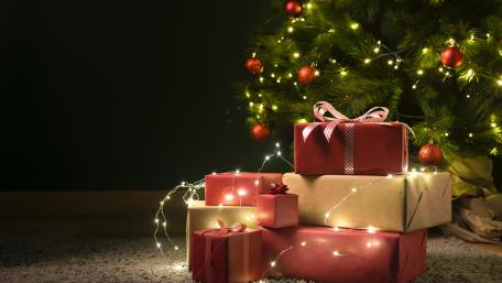 Christmas Eve with Brilliant Gifts under the Tree wallpaper