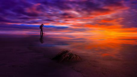 Serene Sunset Reflections on the Beach wallpaper