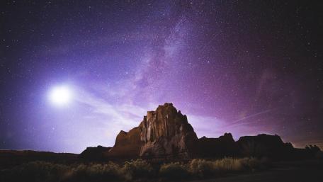 Majestic Milky Way Over Mountain Peaks wallpaper