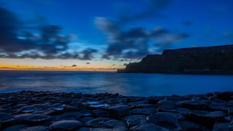 Serene Dusk Over Coastal Rocks wallpaper