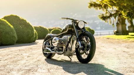 Sleek Black Motorcycle Against Scenic Background wallpaper