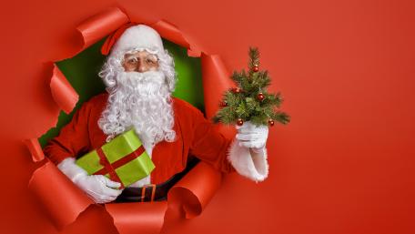 Cheerful Santa Bringing Holiday Joy wallpaper