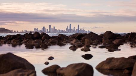 Majestic City Skyline Over Calm Waters wallpaper