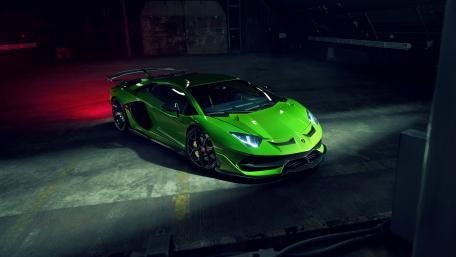 Vibrant Lamborghini Aventador SVJ Roadster in Action wallpaper