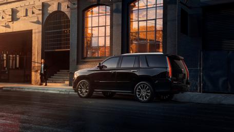Sleek Black SUV in Urban Setting wallpaper