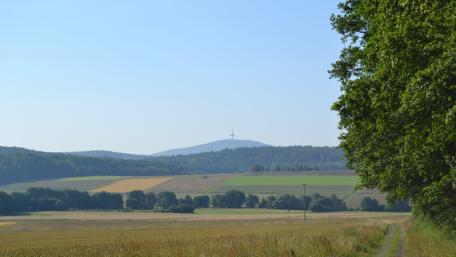 Serene Landscape with Vast Fields and Hills wallpaper