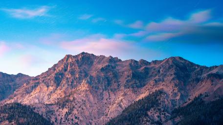 Majestic Mountain Under Brilliant Blue Sky wallpaper