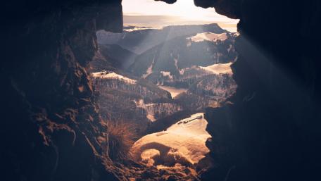Mountain Majesty through a Cave's Eye wallpaper