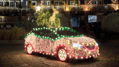 Festive Opel Car Drenched in Christmas Lights wallpaper