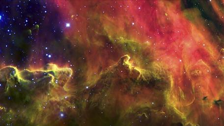 Cosmic Vibrance of Nebulae in Orange Hues wallpaper