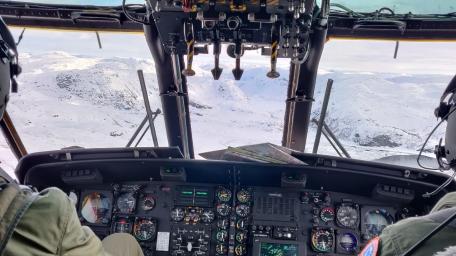 Winter Flight in Military Helicopter Cockpit View wallpaper