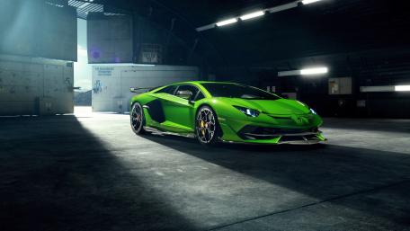 Epic Green Lamborghini Aventador in Industrial Setting wallpaper