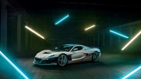 Sleek Dream Car in an Urban Glow wallpaper