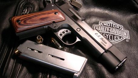 Handgun on Leather Surface wallpaper