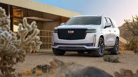 Sleek Cadillac Escalade ESV in Scenic Desert Setting wallpaper