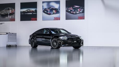 Sleek Audi RS7 in a Modern Showcase Environment wallpaper