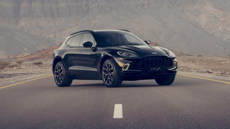 Sleek Aston Martin DBX on Open Road wallpaper