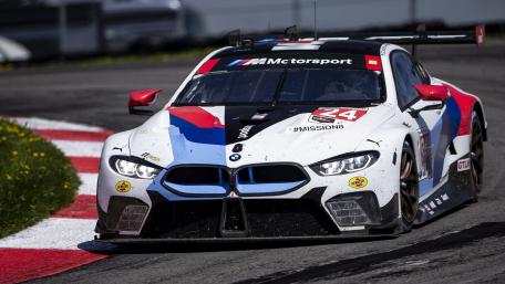 Dynamic BMW Race Car in Action on Track wallpaper