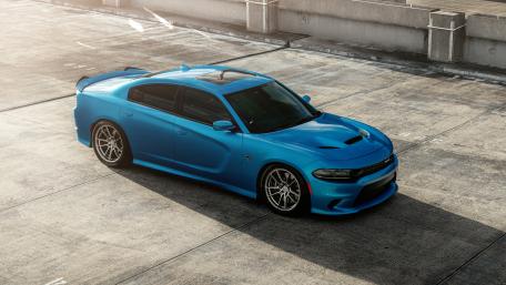 Sleek Blue Charger in Urban Setting wallpaper