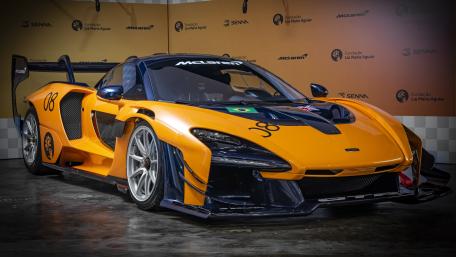 McLaren Senna GTR in Vibrant Yellow Displayed Indoors wallpaper